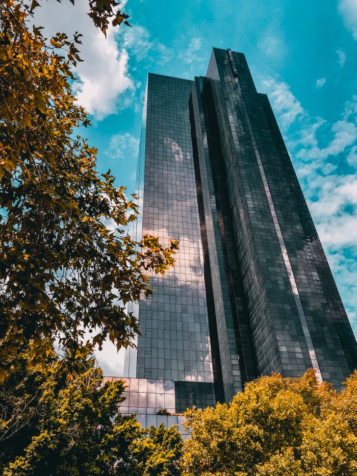 Contemporary skyscraper set against a vibrant sky in Pretoria, South Africa.